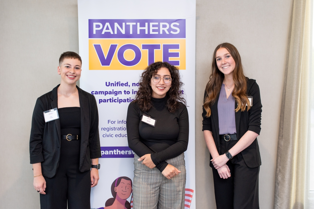 Students standing in front of Panthers Vote sign