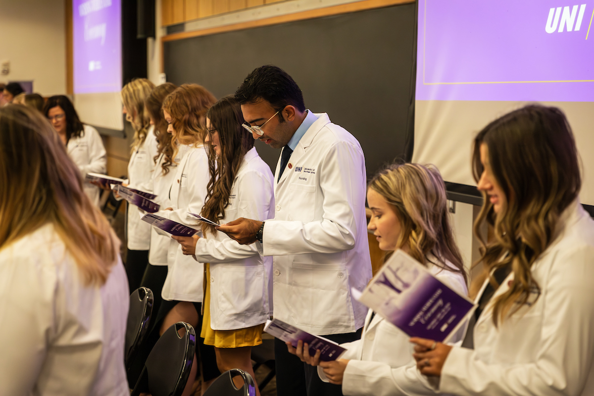 UNI nursing students reciting nursing oath at White Coat Ceremony